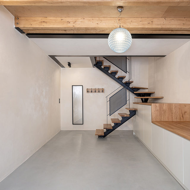 Modern interior with a microcement floor coating