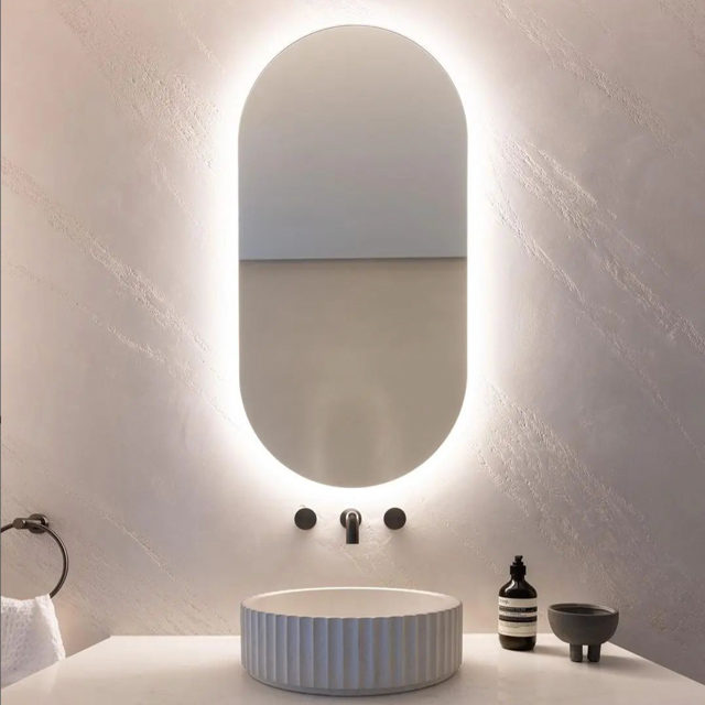Decorative plaster resembling white stone on an elegant bathroom's walls